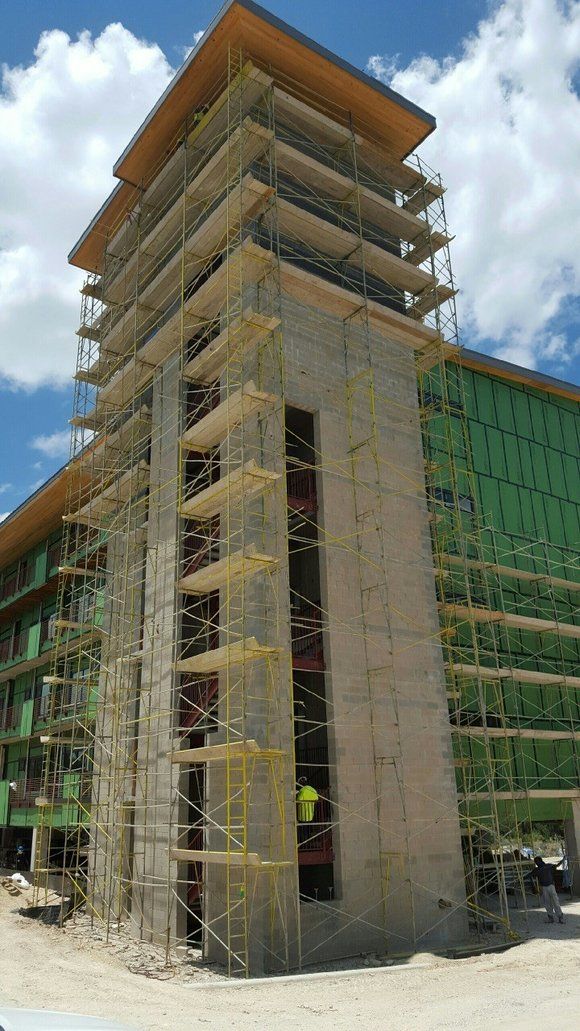 A large building under construction with scaffolding around it