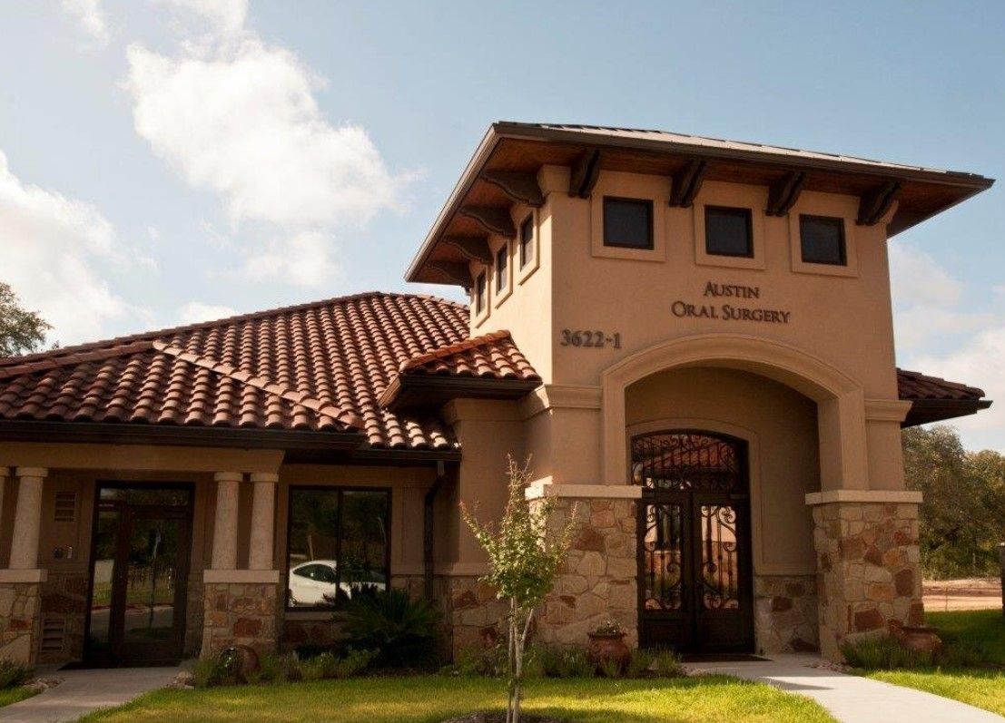 A building with a sign that says austin oral surgery