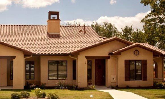 A house with a tiled roof and a chimney