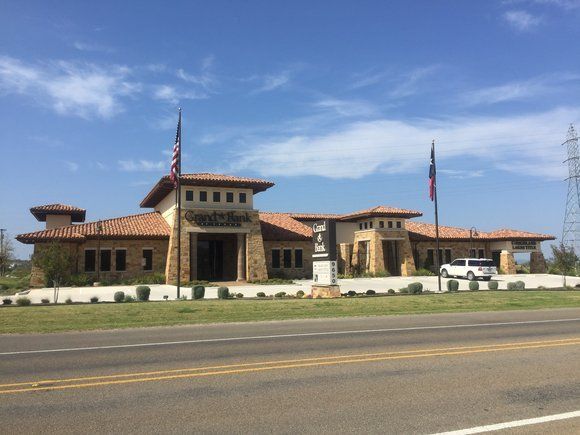 A large building with a flag on the side of it