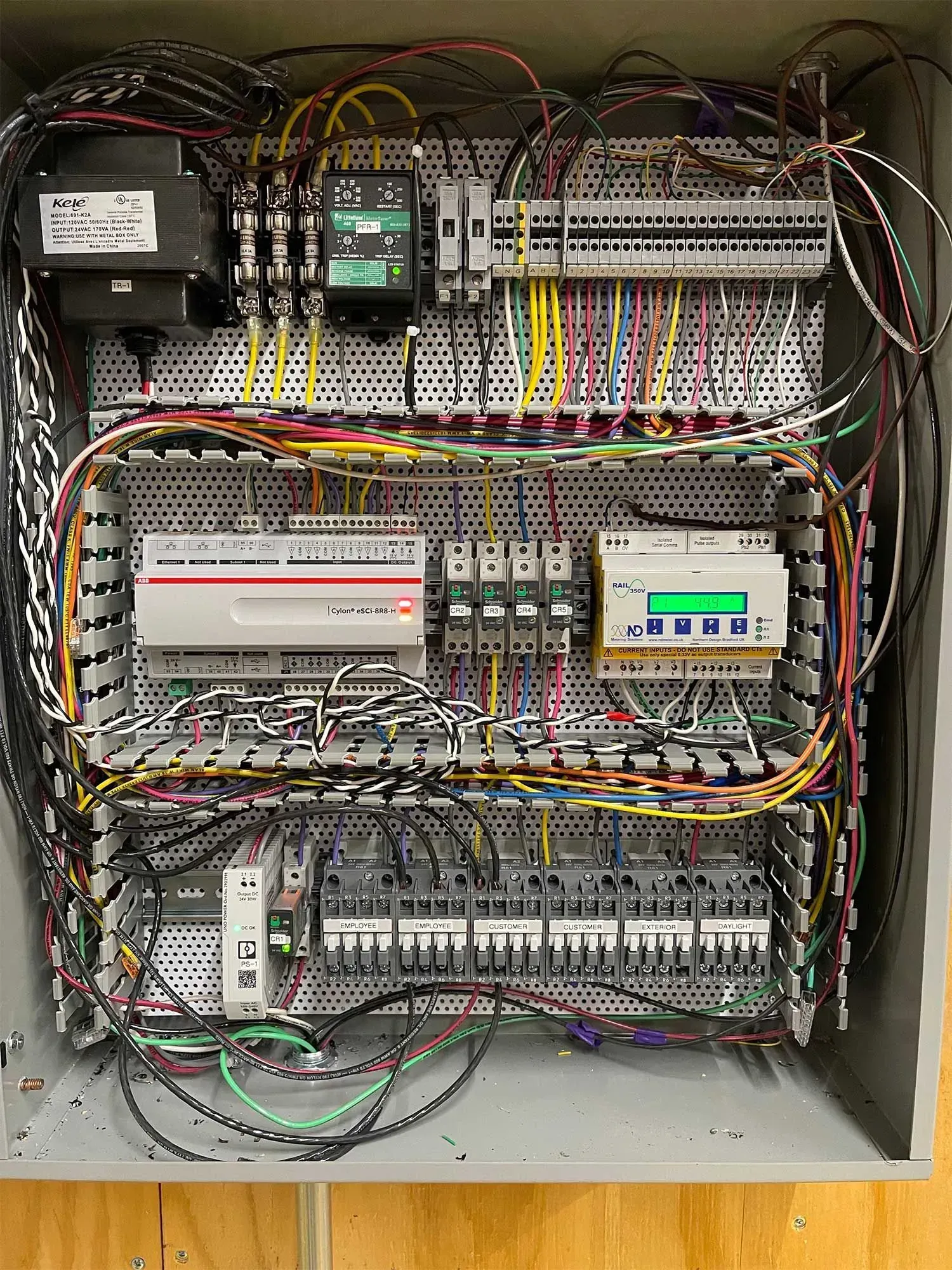 Electrical control panel with wires and components.