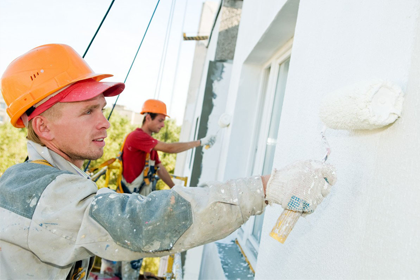 Two guys painting the house