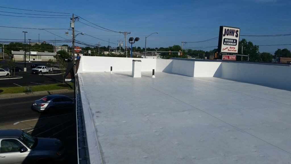 A car is parked on the roof of a building.
