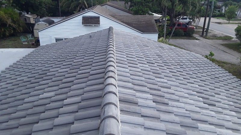 An aerial view of a tiled roof of a house.