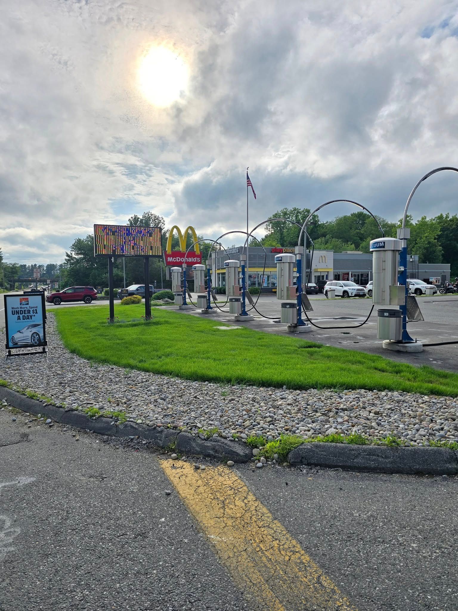 A sunny outdoor view of an EV charging station area