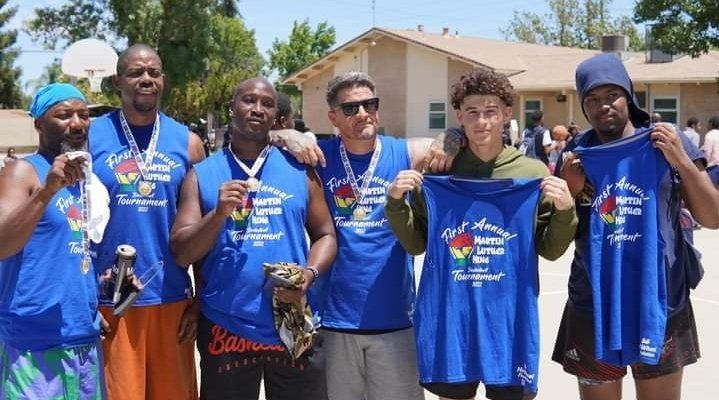 basketball team photo holding and wearing uniform