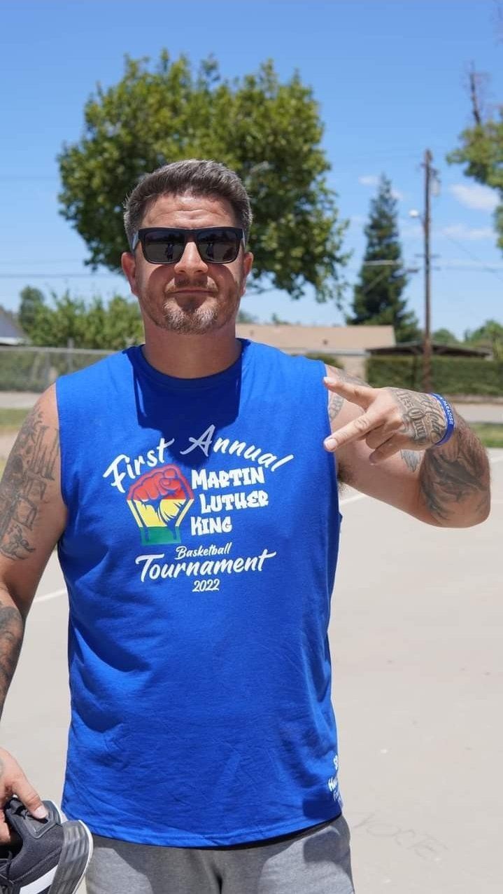 man with shades on the basketball court