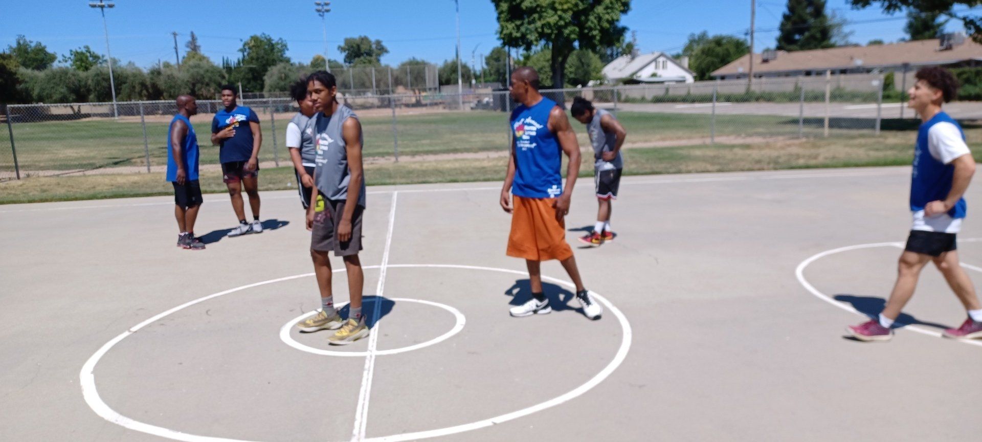 men starting to play basketball