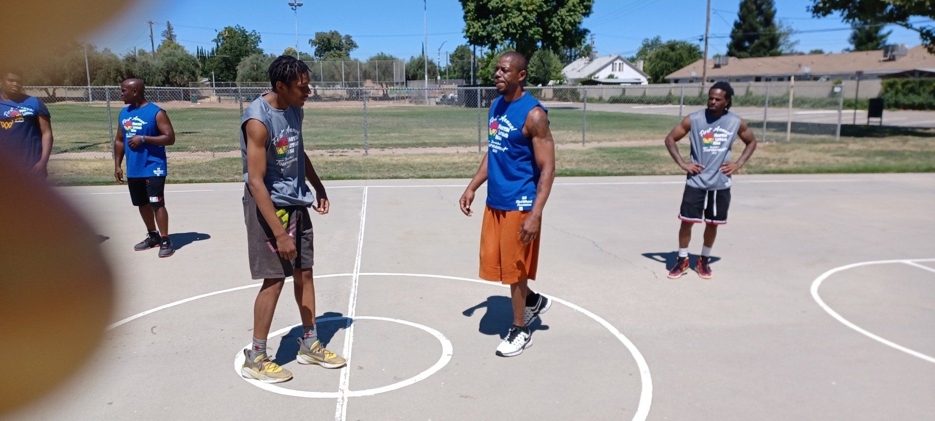 men starting to jumpball in basketball