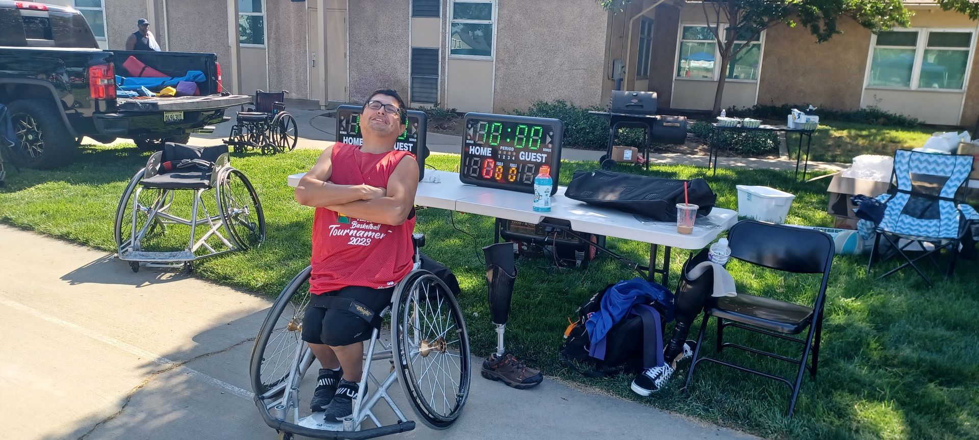 Man on a red jersey sitting on a wheelchair