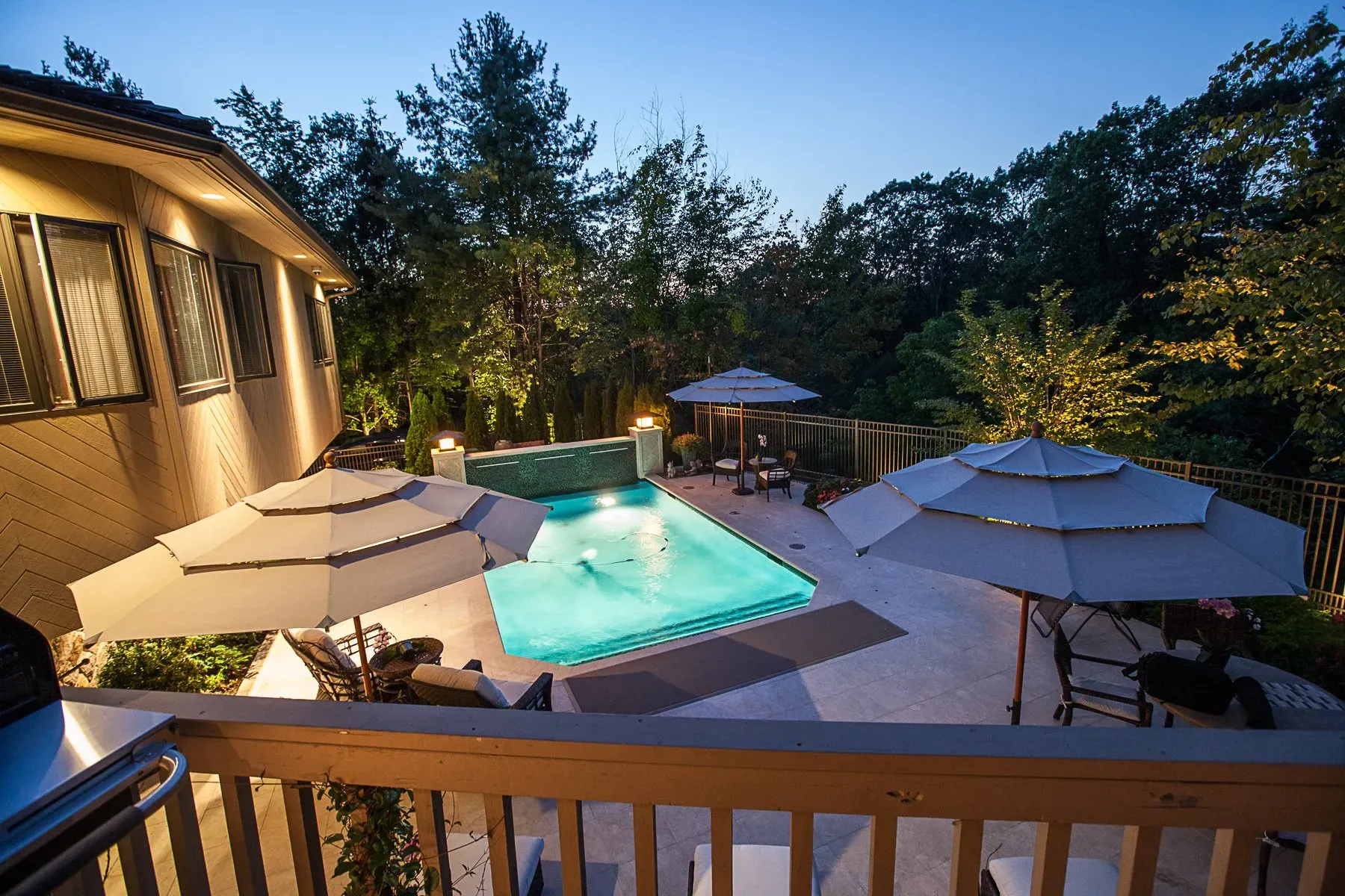 Outdoor pool lighting with custom landscape lighting