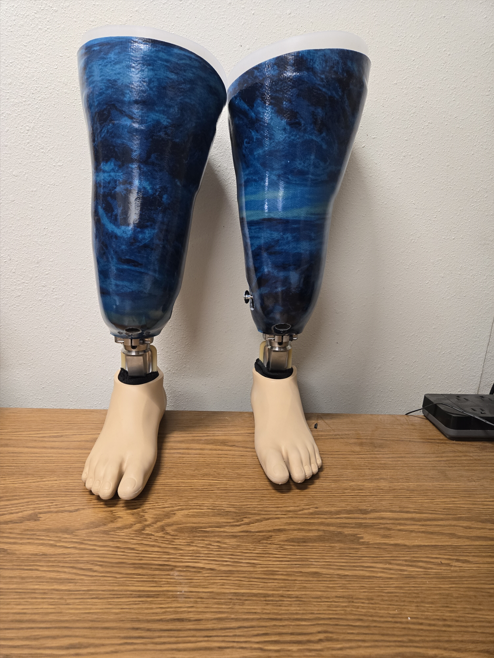 A pair of blue prosthetic legs and feet