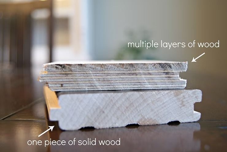 Cross-section of layered wood flooring compared to solid wood flooring, showing construction differences.