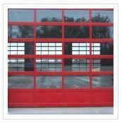 A red garage door with a lot of windows.