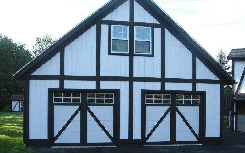 A black and white garage with two garage doors
