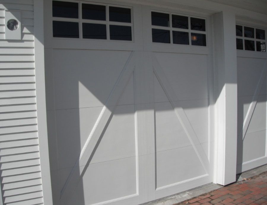 A white garage door with a black window