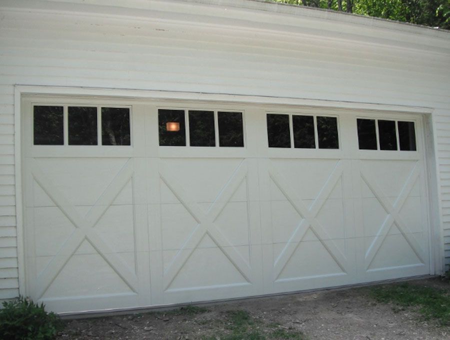 A white garage door with a lot of windows