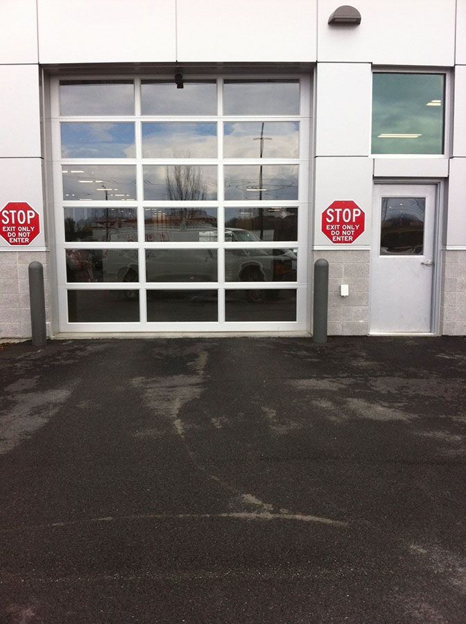 A garage door with a stop sign on it