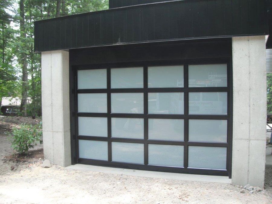 A black garage door with white squares on it