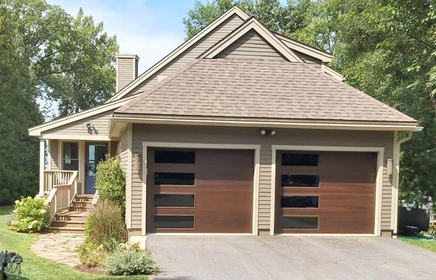 A house with two garage doors and a driveway