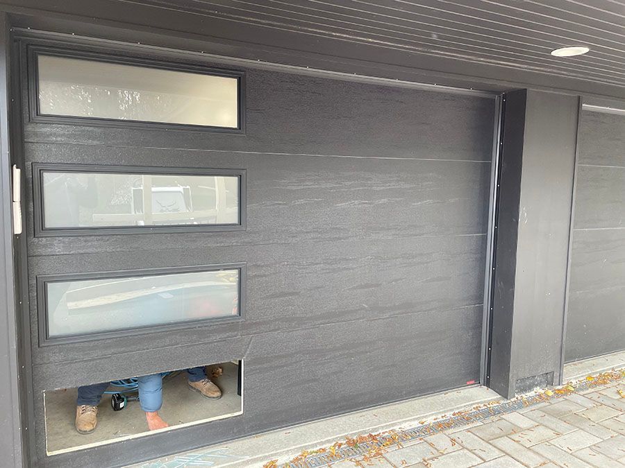 A garage door with windows