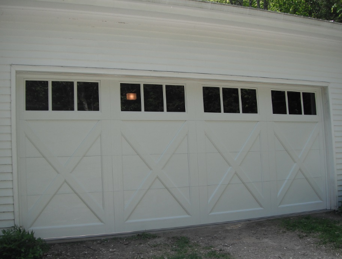 A white garage door with a lot of windows