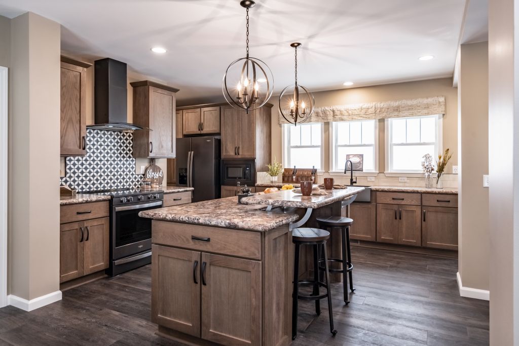 Kitchen with island, cabinets, and appliances in a modern home.