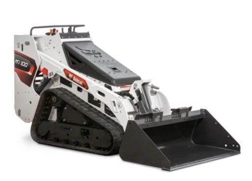 A white Bobcat MT100 stand-on track loader with a black front bucket, viewed from a side angle on a white background.