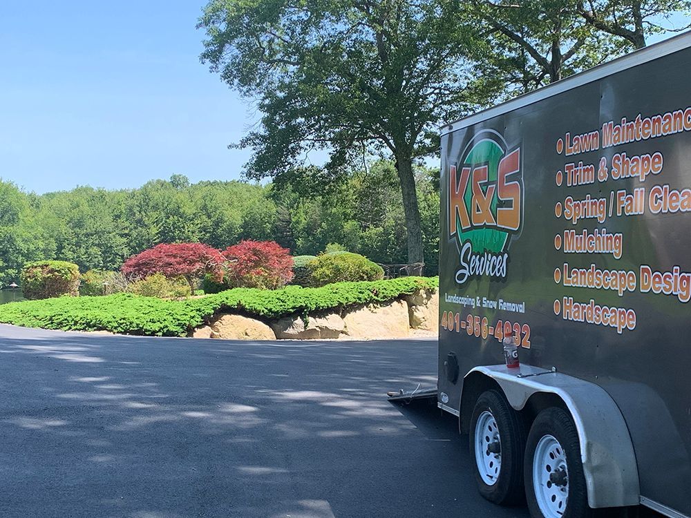 A trailer is parked on the side of the road.