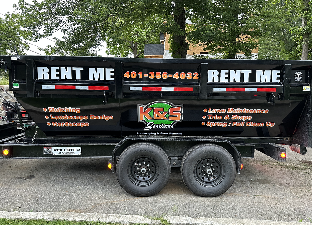 A dumpster with the words rent me on it