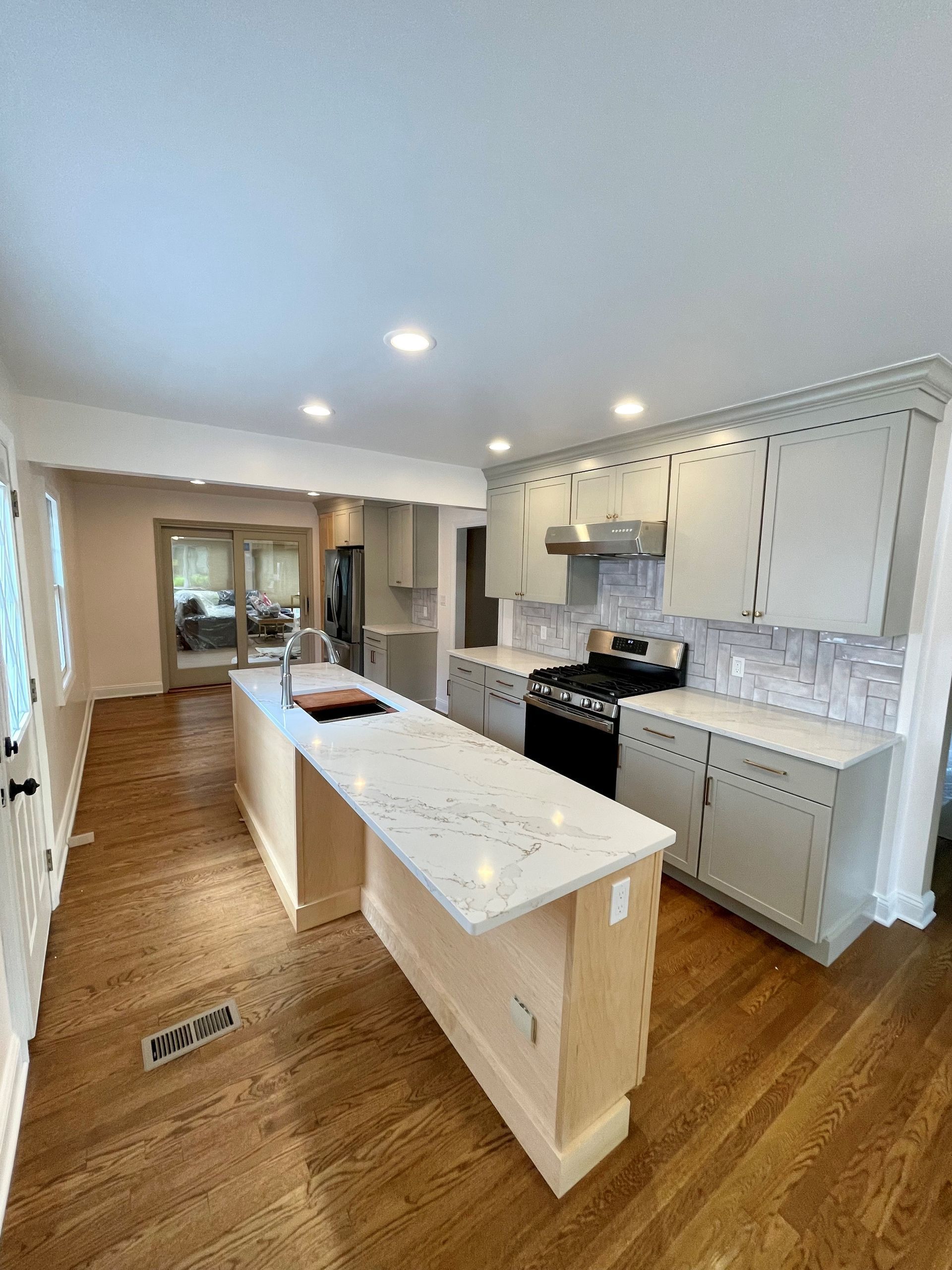 A kitchen with a large island in the middle of the room.