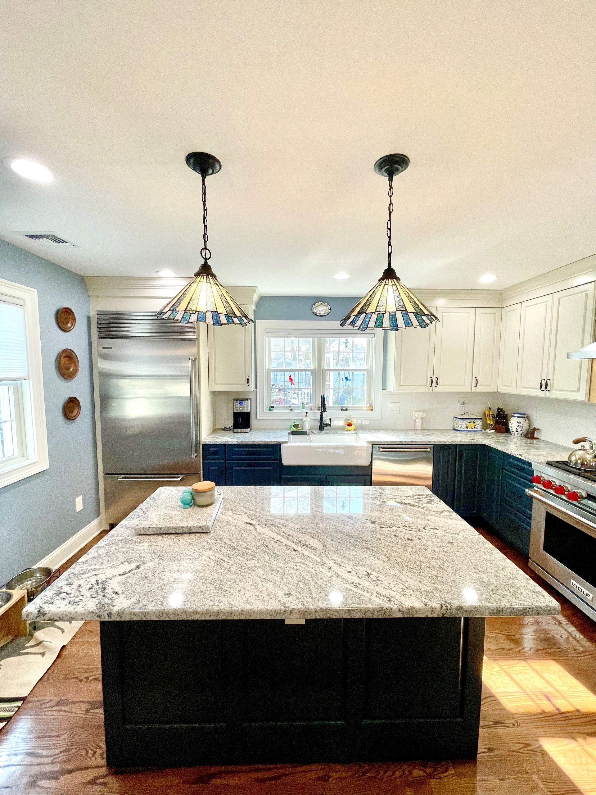 A kitchen with granite counter tops and stainless steel appliances