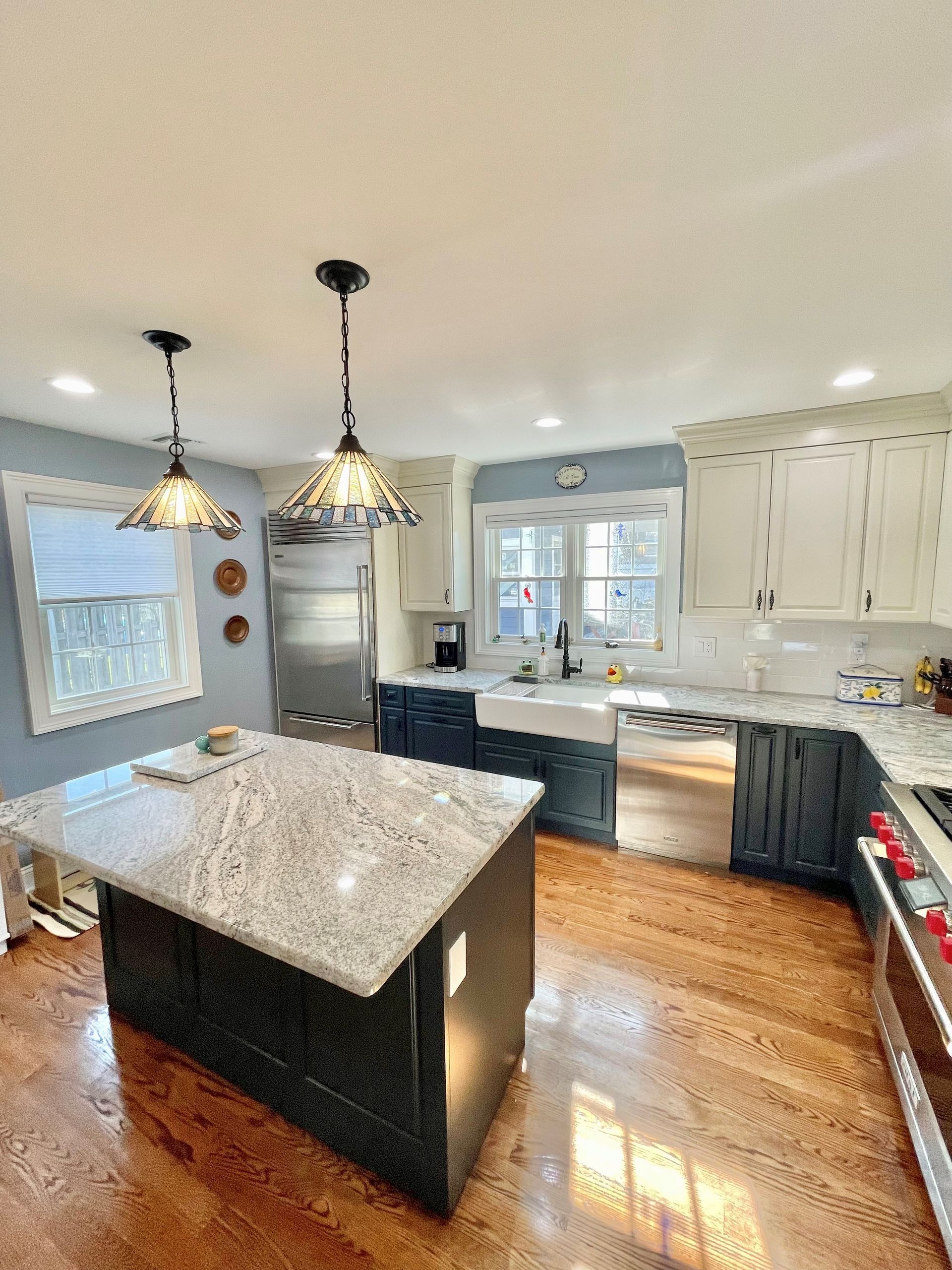 A kitchen with stainless steel appliances and granite counter tops.