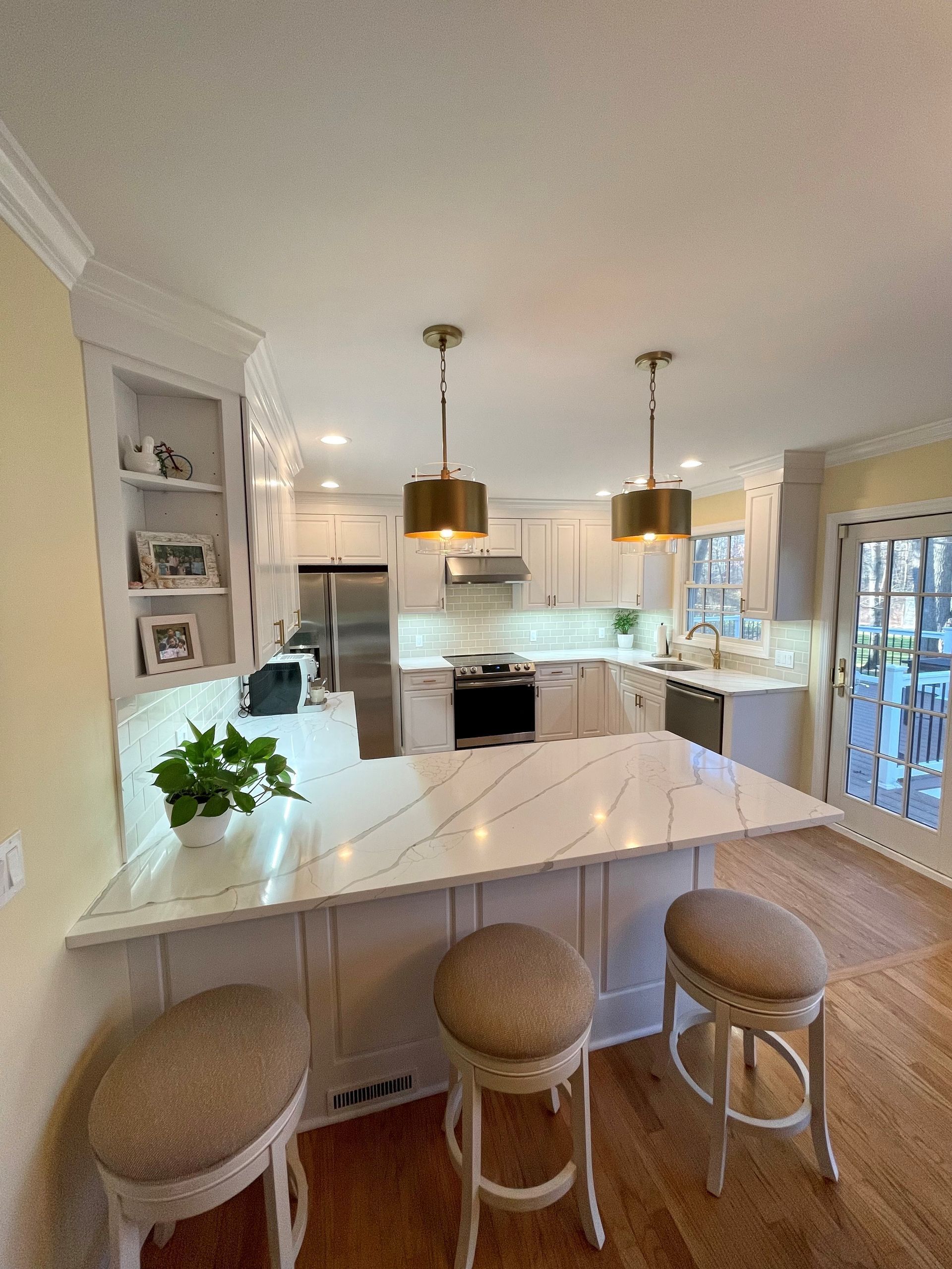A kitchen with a large island and stools