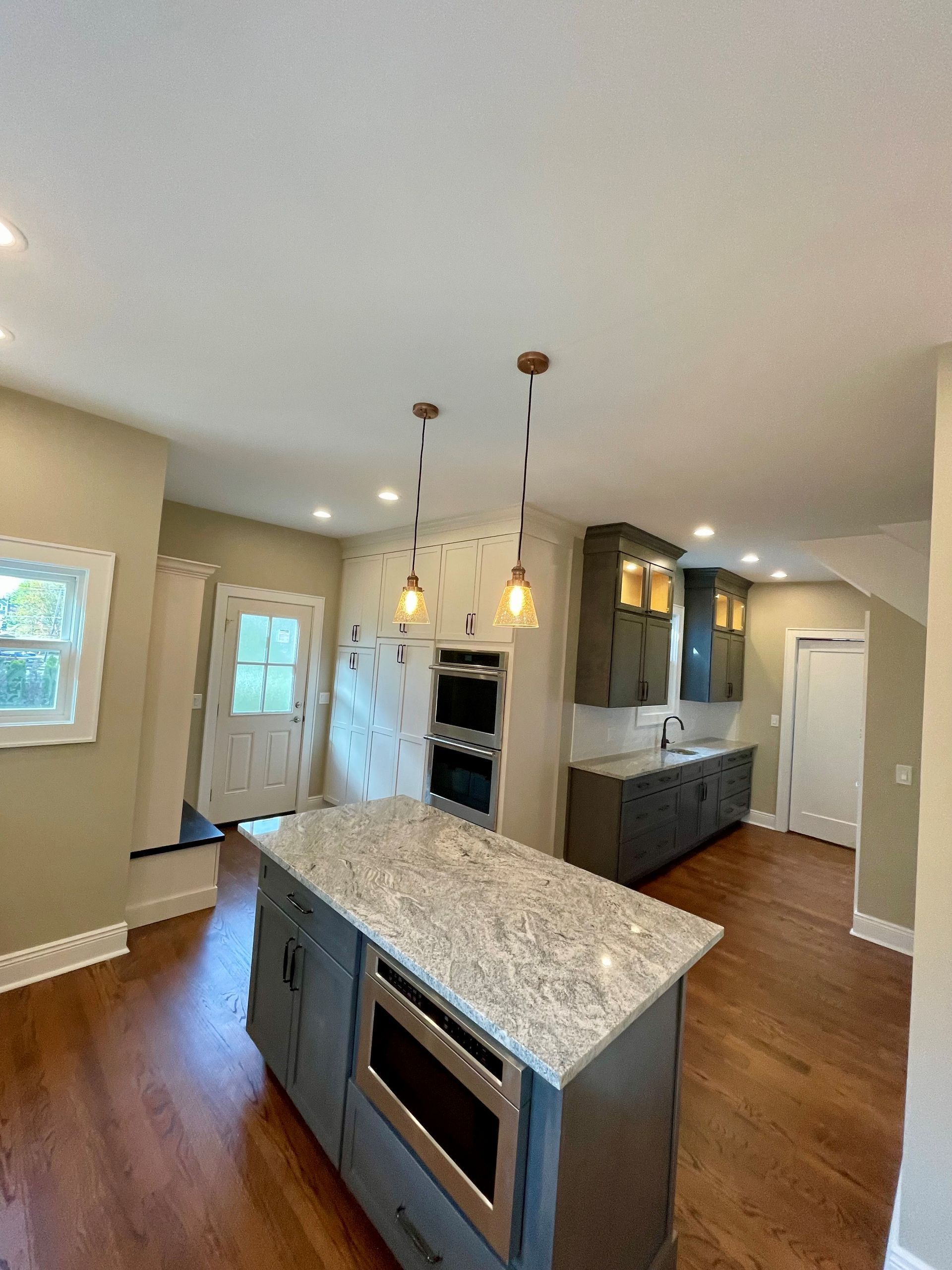 There is a large island in the middle of the kitchen.