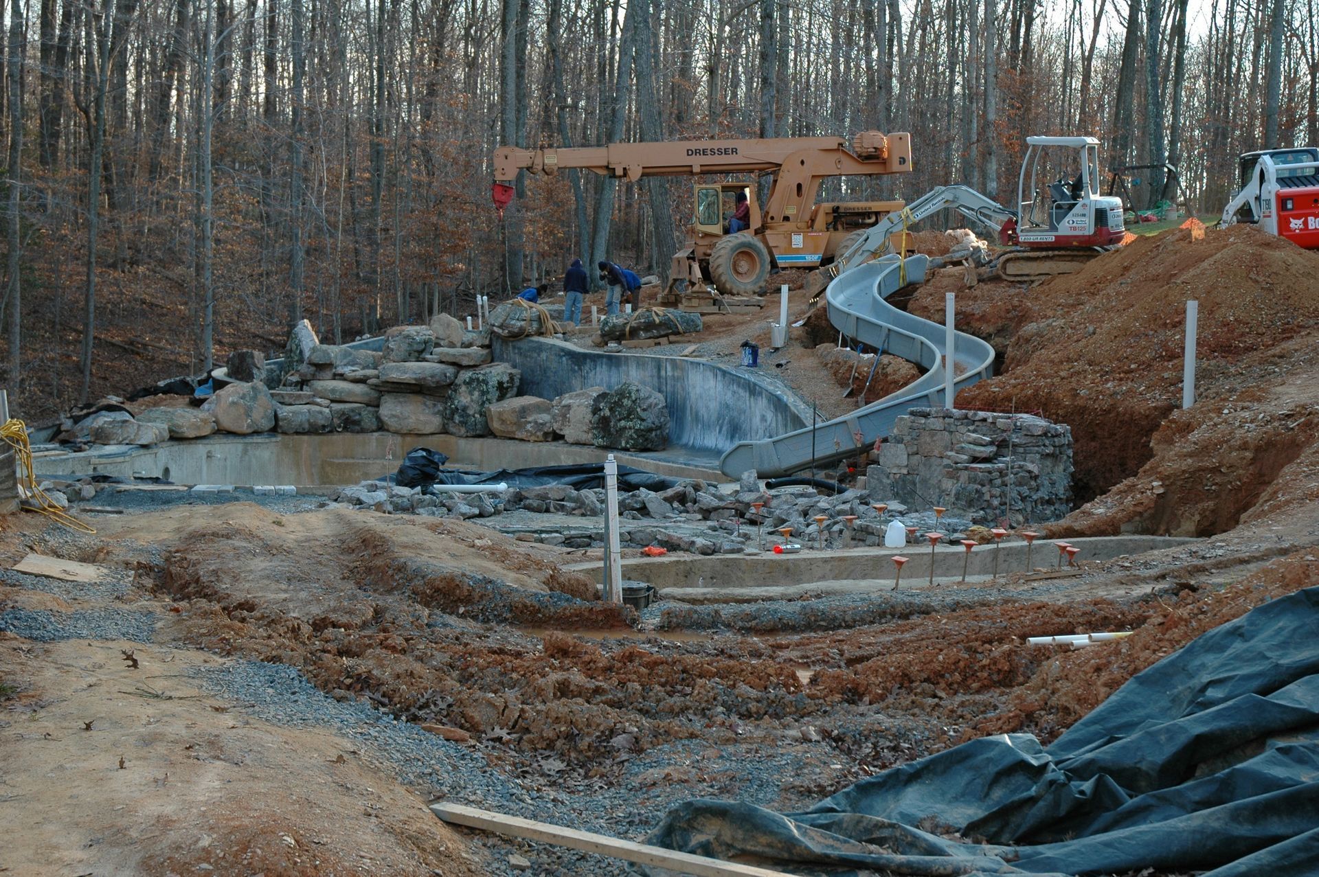 A construction site with a slide in the middle of it
