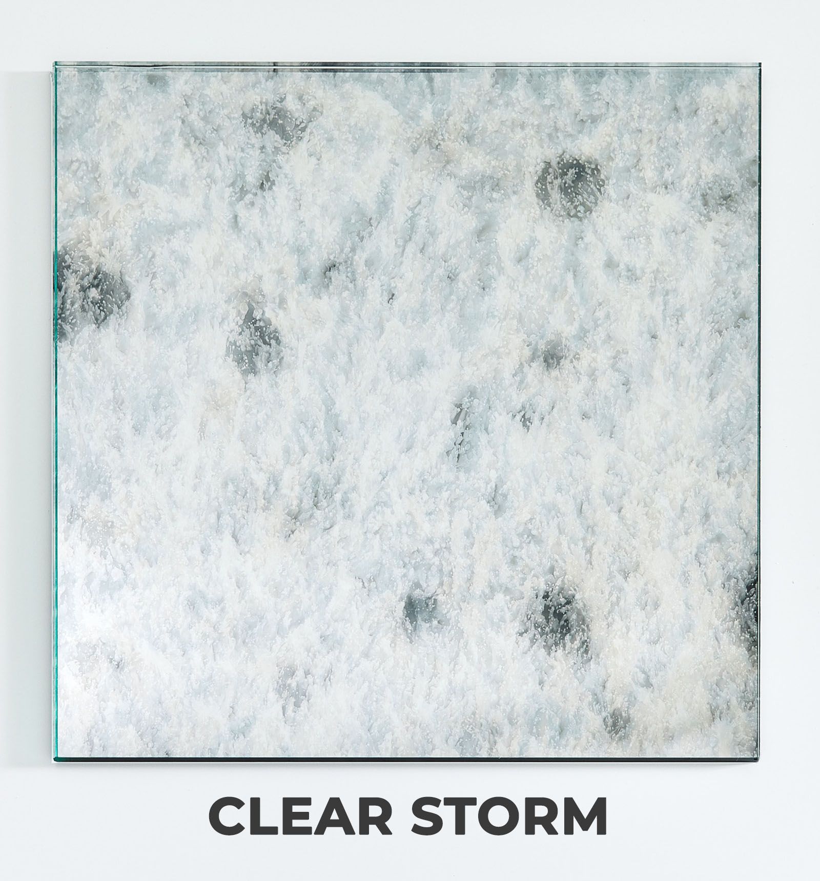 A square, weathered mirror with a mottled, cloudy texture featuring dark gray and silver spots labeled Clear Storm.