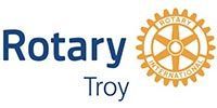 A logo for the rotary club of troy with a gear.