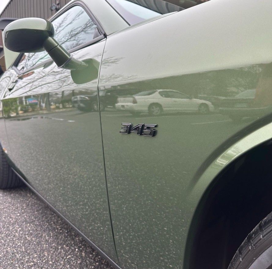 Green Dodge Challenger car with 