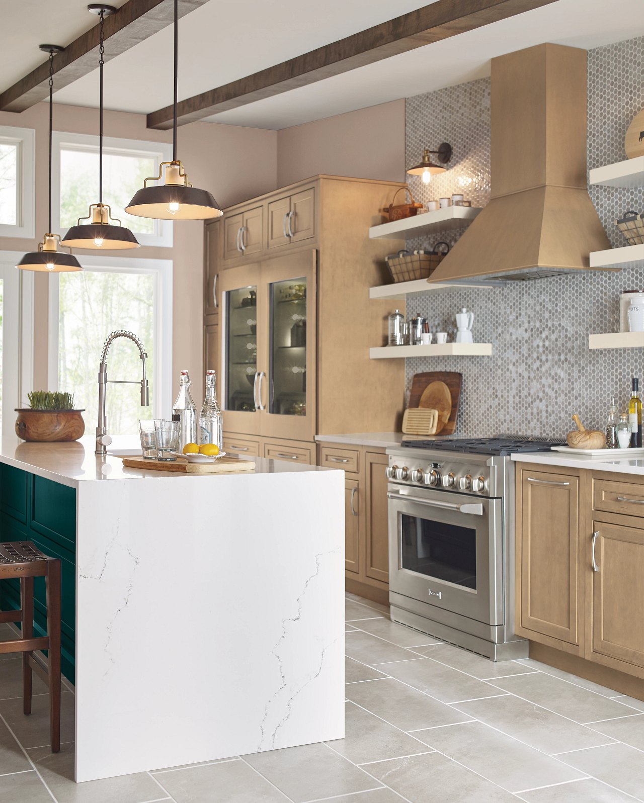 A kitchen with stainless steel appliances , wooden cabinets , and a large island.