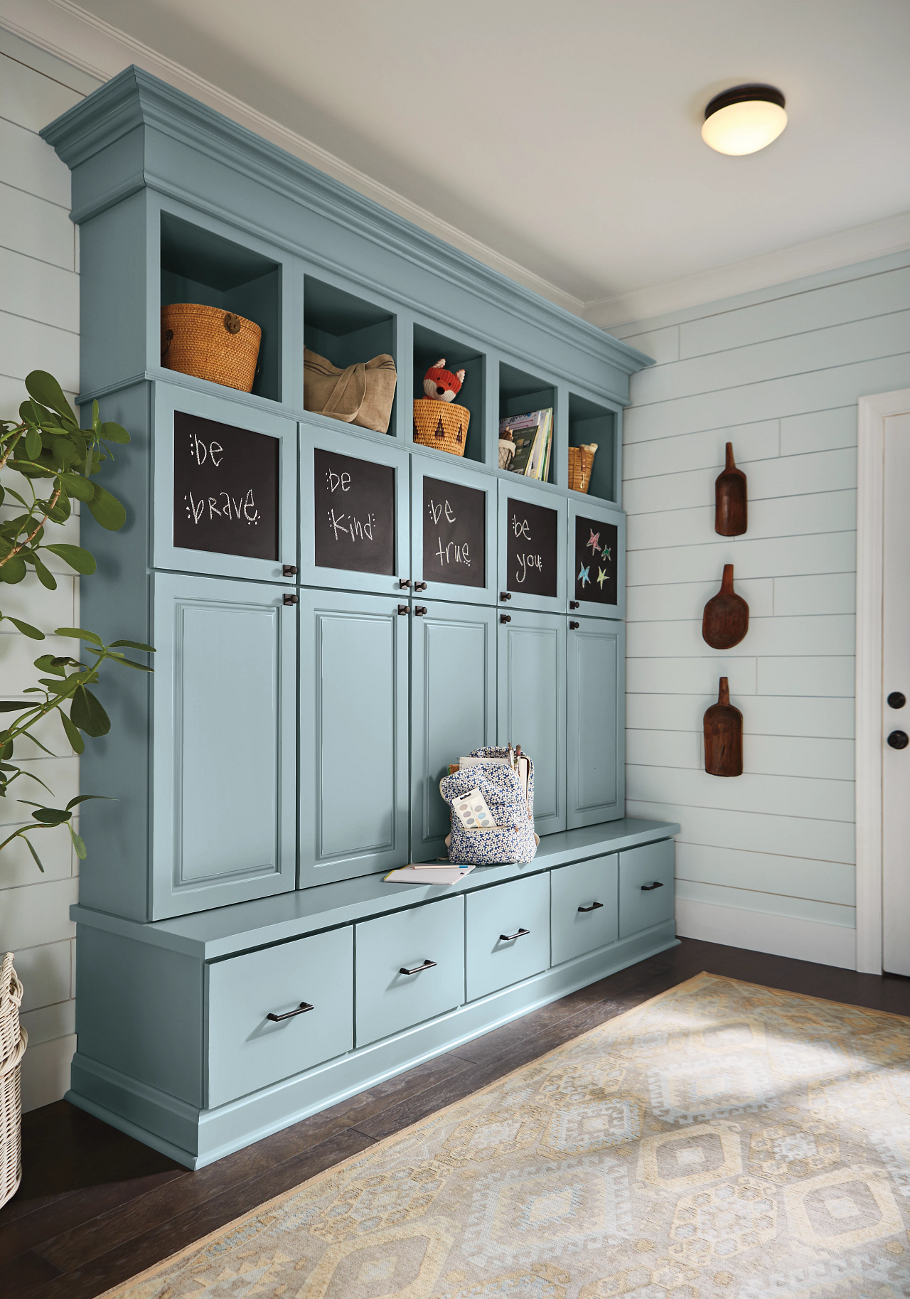 A kitchen with white cabinets and a stove top oven