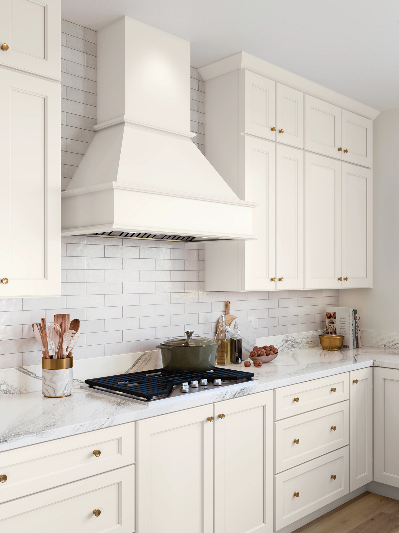 A kitchen with white cabinets and a stove top oven