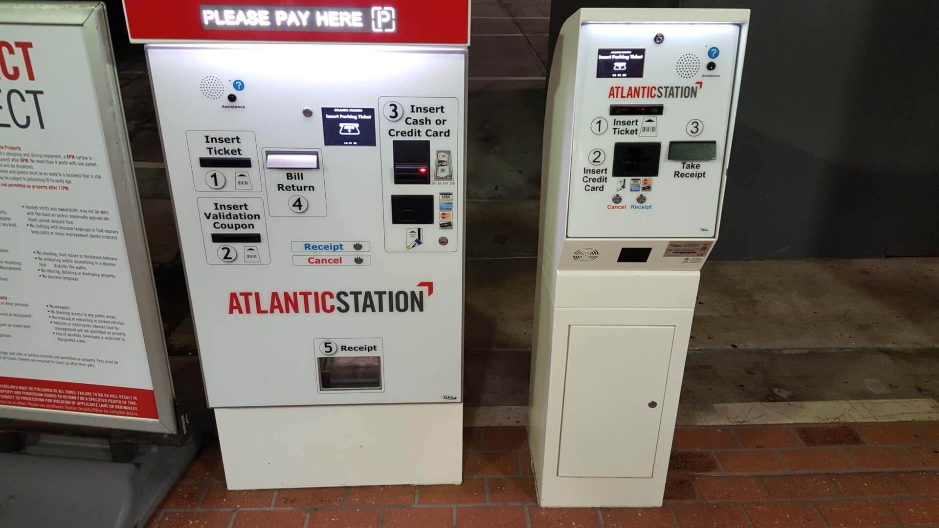 Two atlantic station machines are sitting next to each other