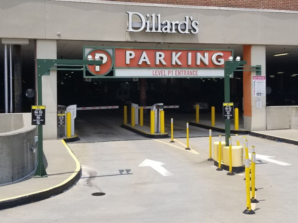 The entrance to a parking garage at dillard 's