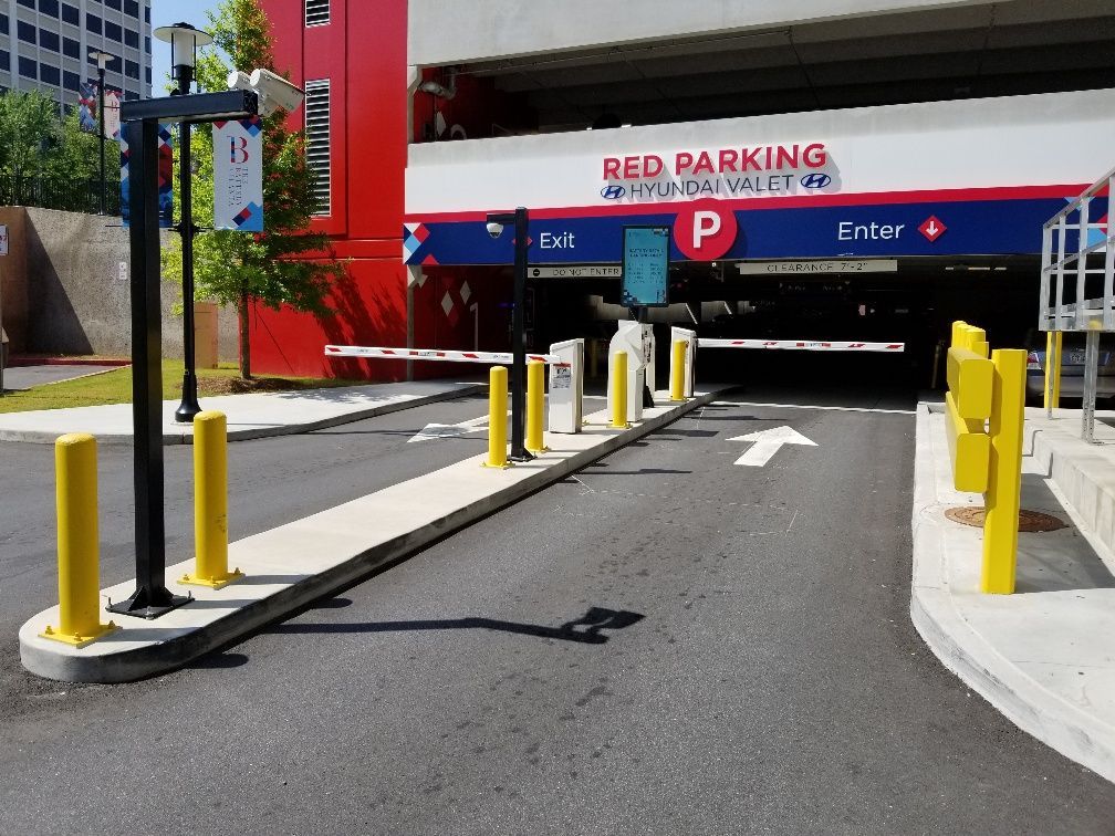 A parking garage with a red sign that says red parking