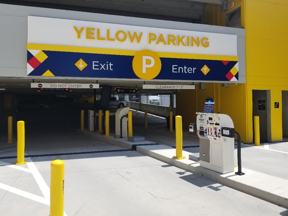A parking garage with a sign that says yellow parking