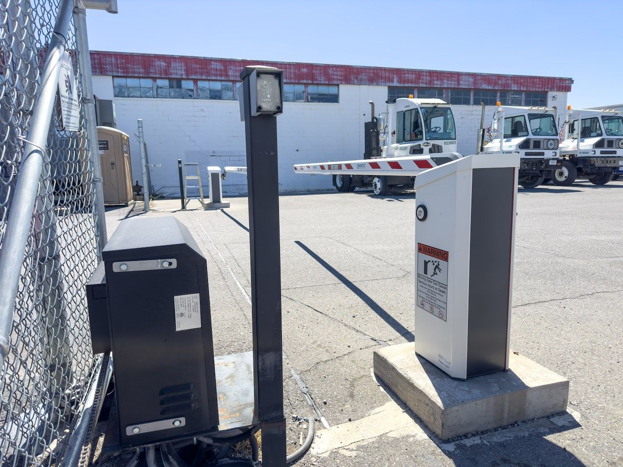 A parking lot with a barrier that says ' no parking ' on it