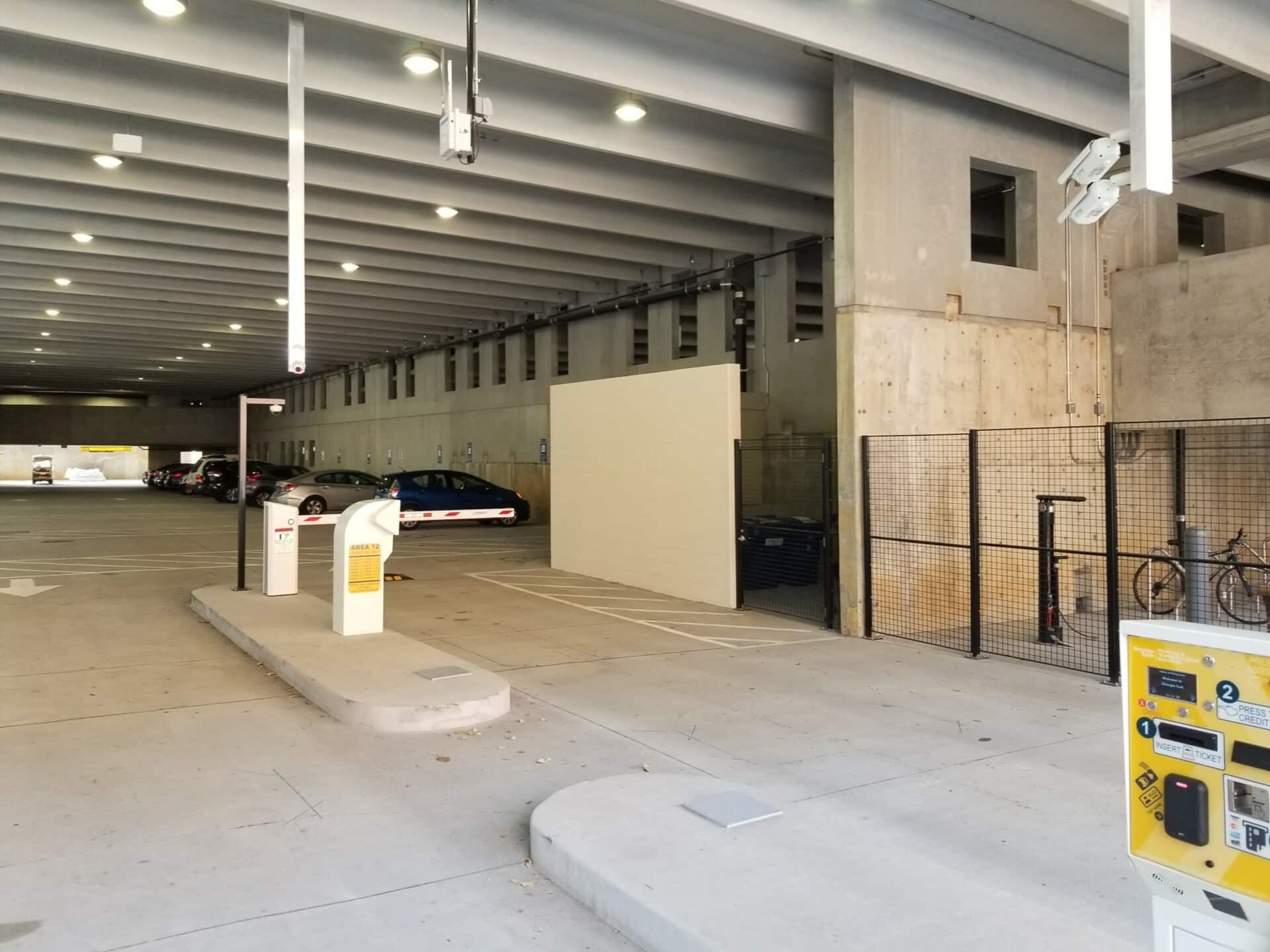 A parking garage with cars parked inside of it