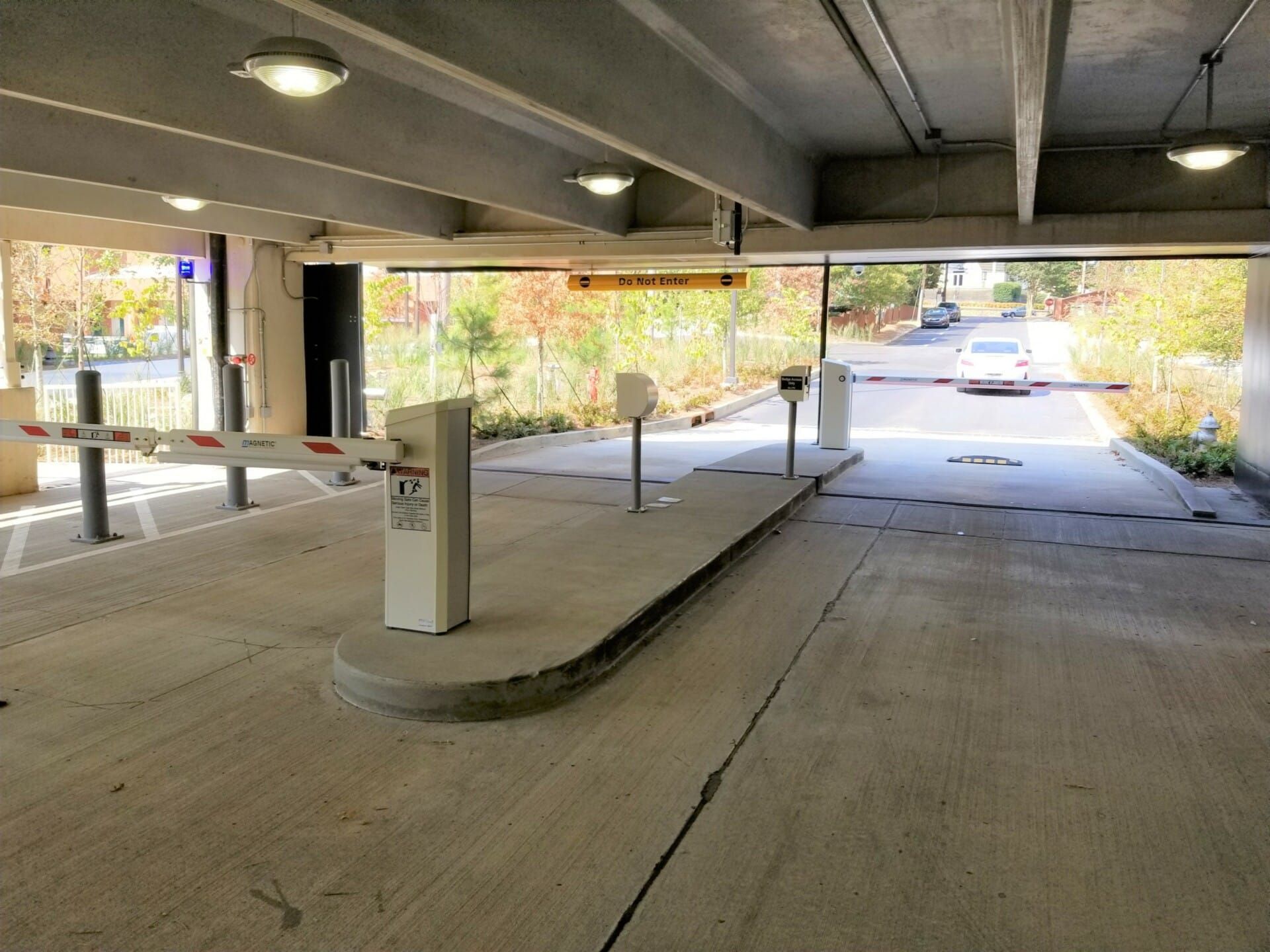 A parking garage with a barrier in the middle of it