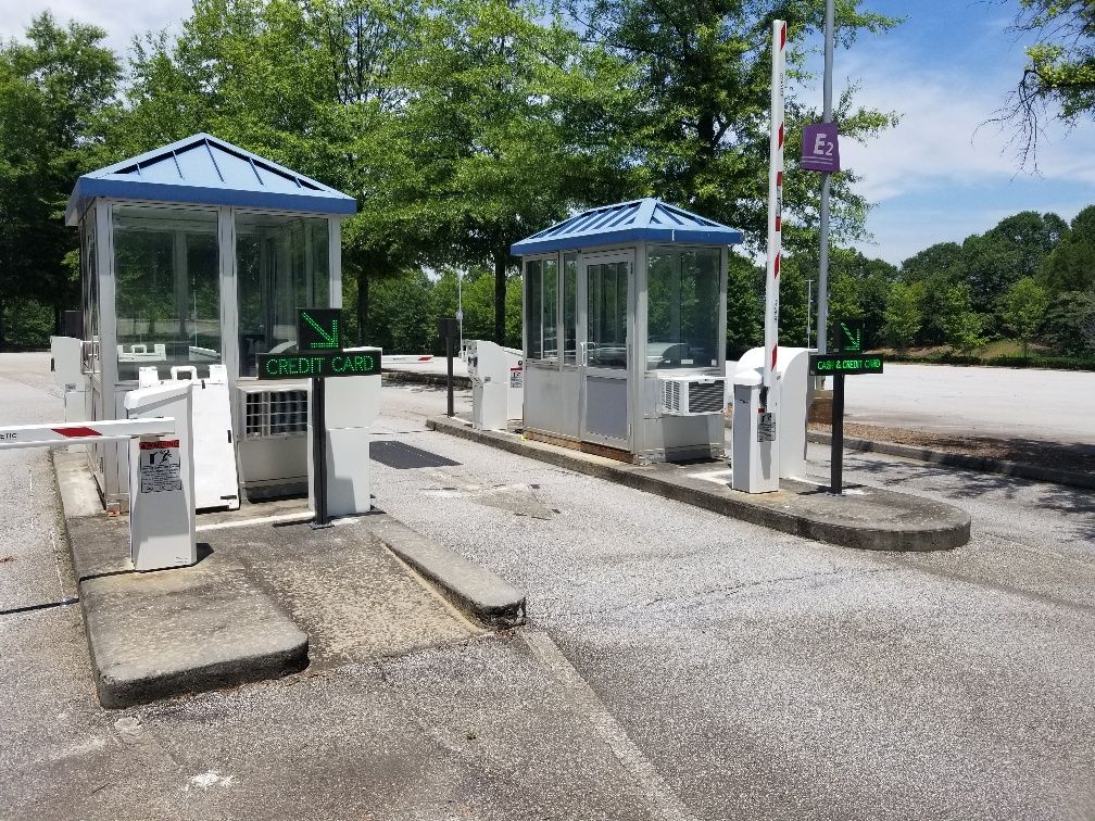 A parking lot with a lot of barriers and a sign that says parking only